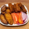 Fried plantain with beef suya, fresh tomatoes and onion