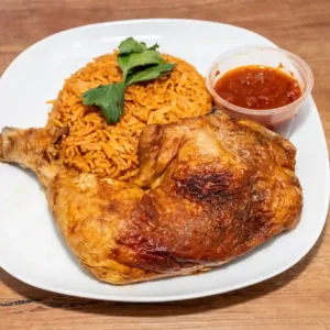 Grilled Chicken Maryland with jollof rice and native red stew